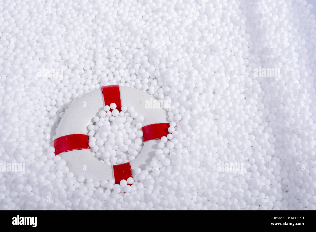 lifesaver on little white polystyrene foam balls Stock Photo - Alamy