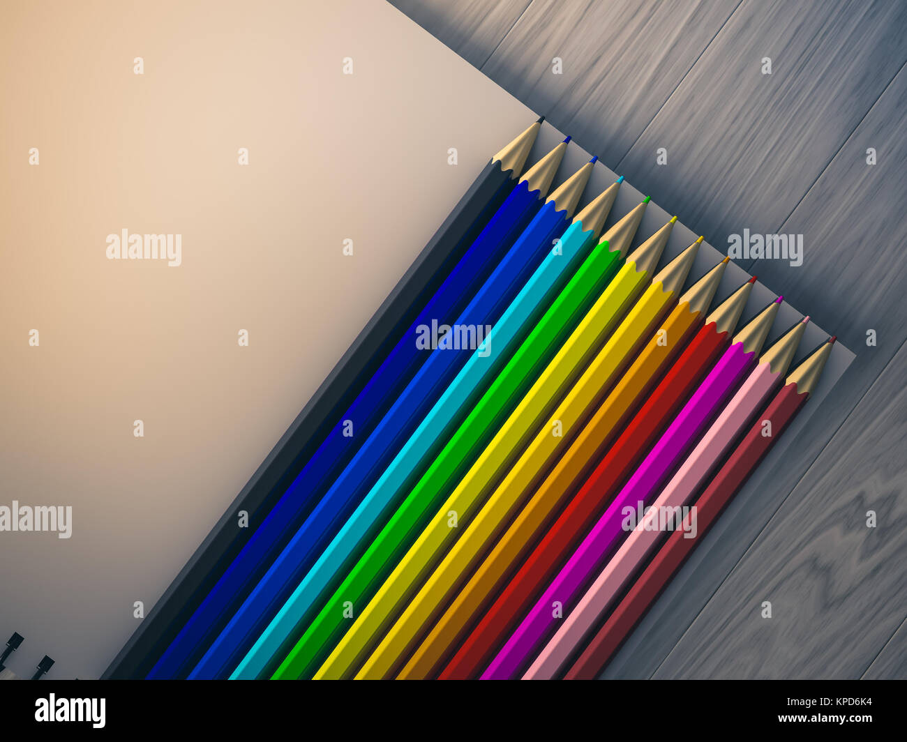 color pencil on checked notebook on wood background Stock Photo