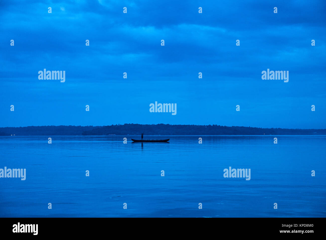 Beautiful lake sunset with fisherman boats Stock Photo - Alamy