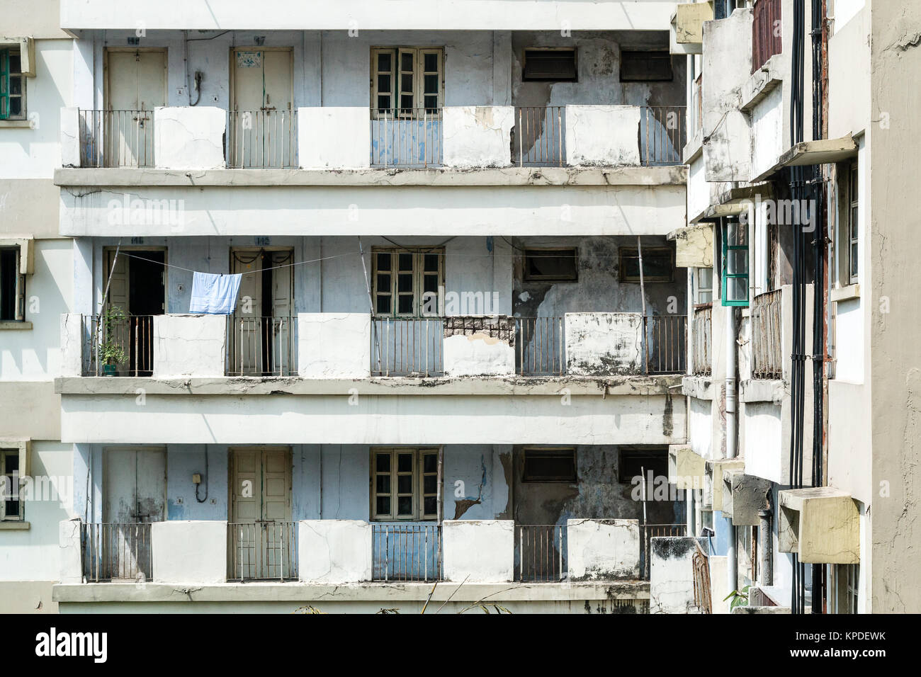 Derelict appartments in Calcutta (Kolkata) India.  Towel hanging outside shows they are still in use Stock Photo