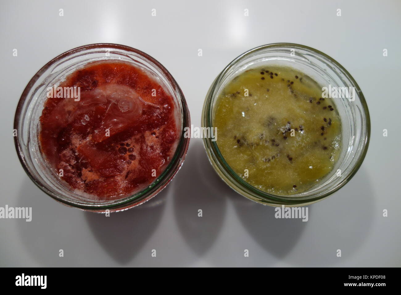 frozen kiwimarmelade and strawberry jam in the glass Stock Photo - Alamy