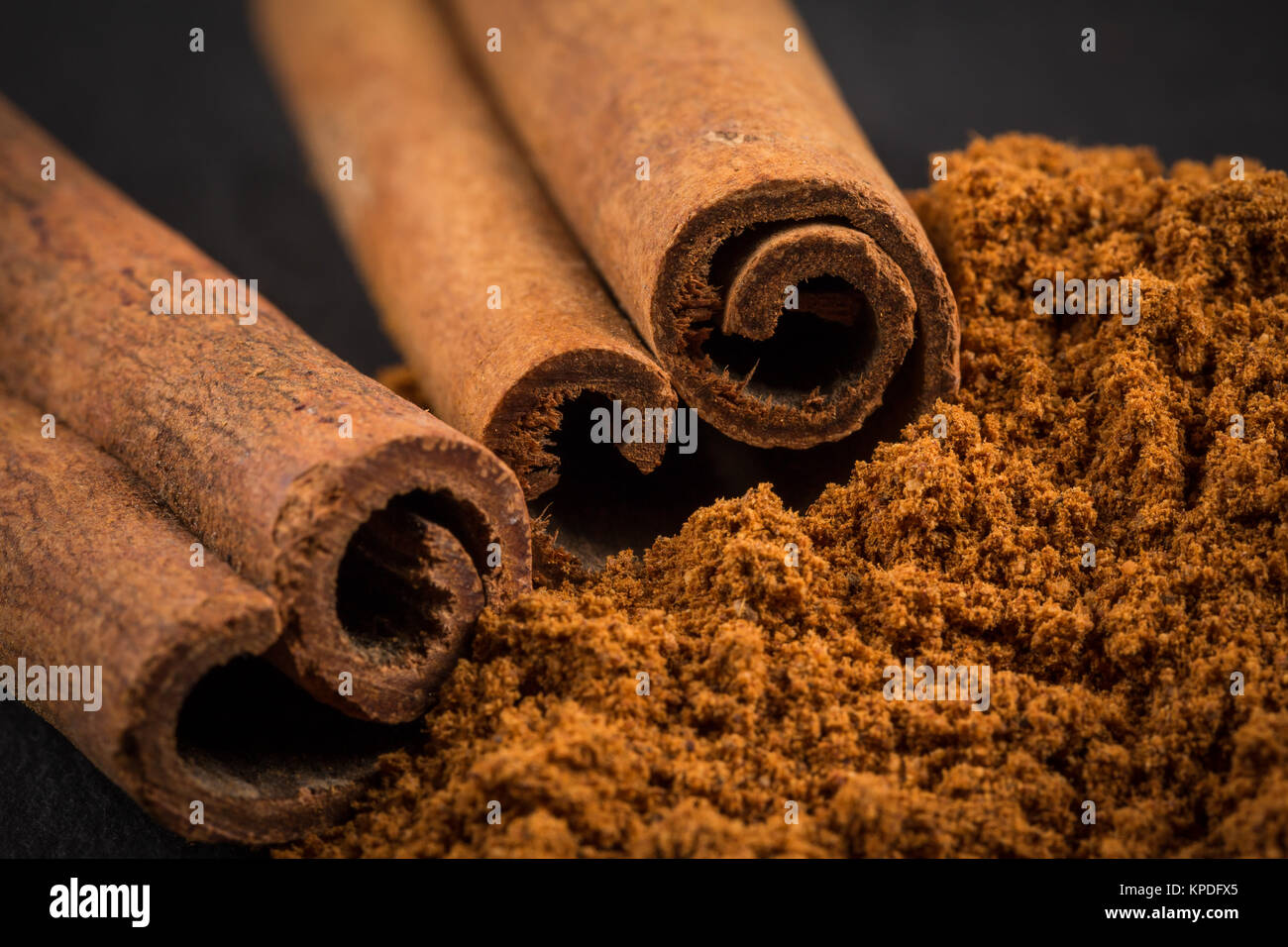 Cinnamon sticks with powder Stock Photo Alamy