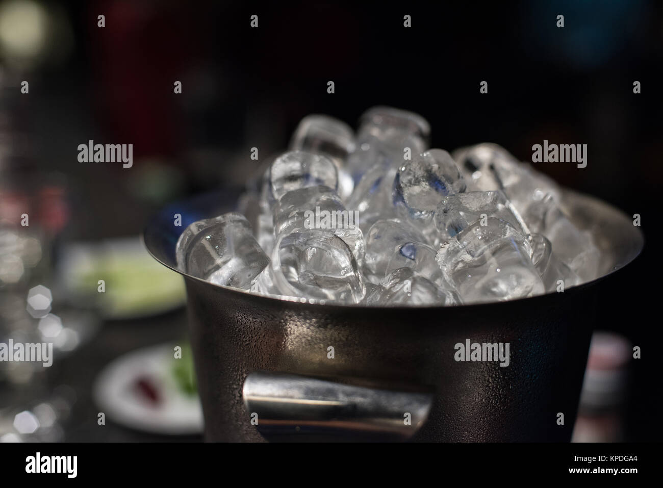 Ice bucket with ice cubes Stock Photo Alamy