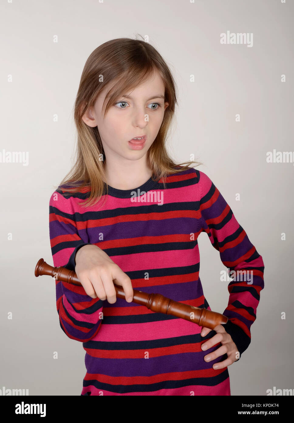 angry girl with recorder Stock Photo