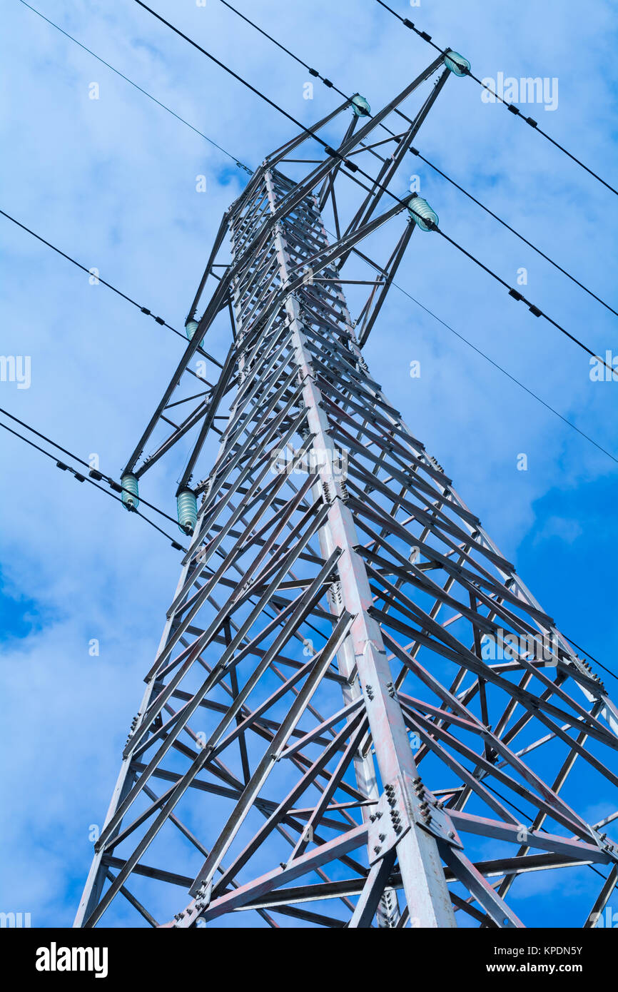 Power pole with high voltage against the blue sky Stock Photo - Alamy