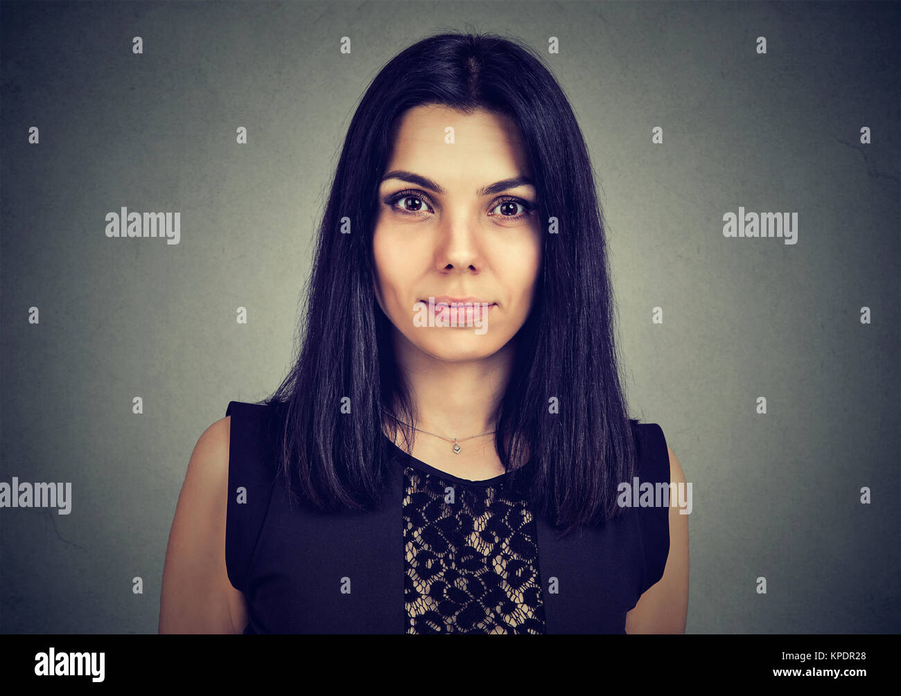 Portrait of a serious young woman looking at camera Stock Photo - Alamy