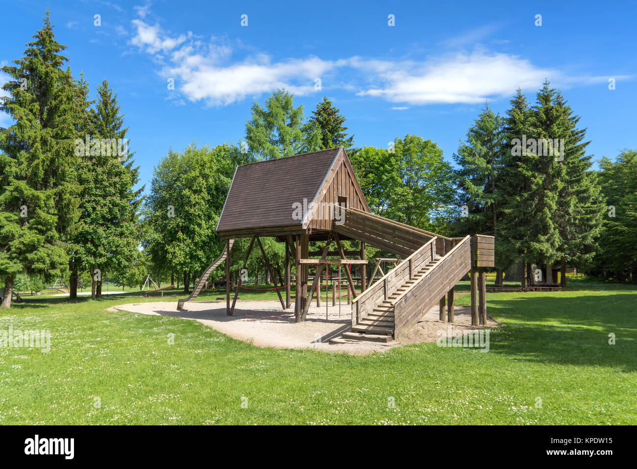 playground with wooden house in a clearing in the forest - rossberg,swabian alb Stock Photo