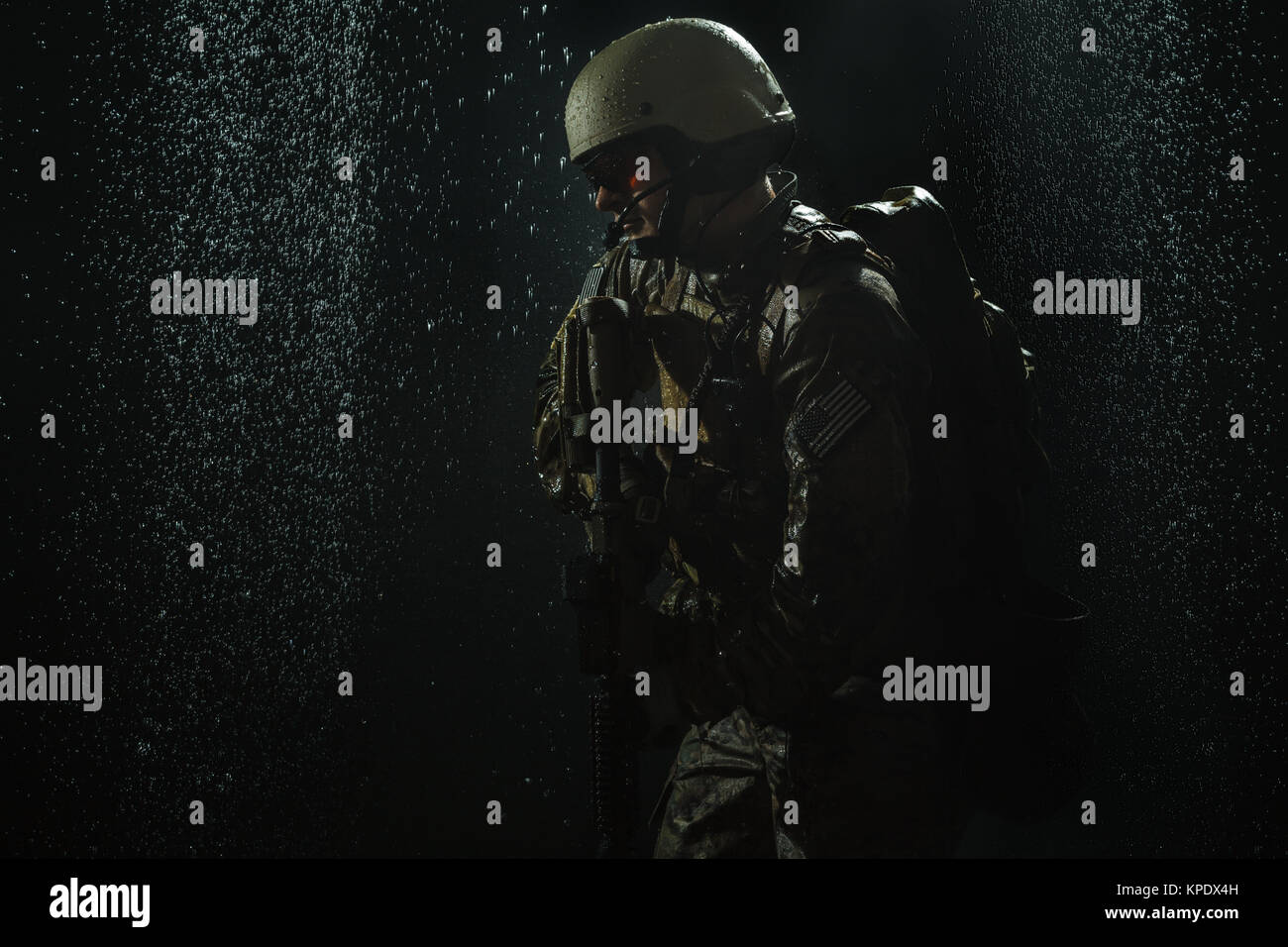 US Army soldier in the rain Stock Photo