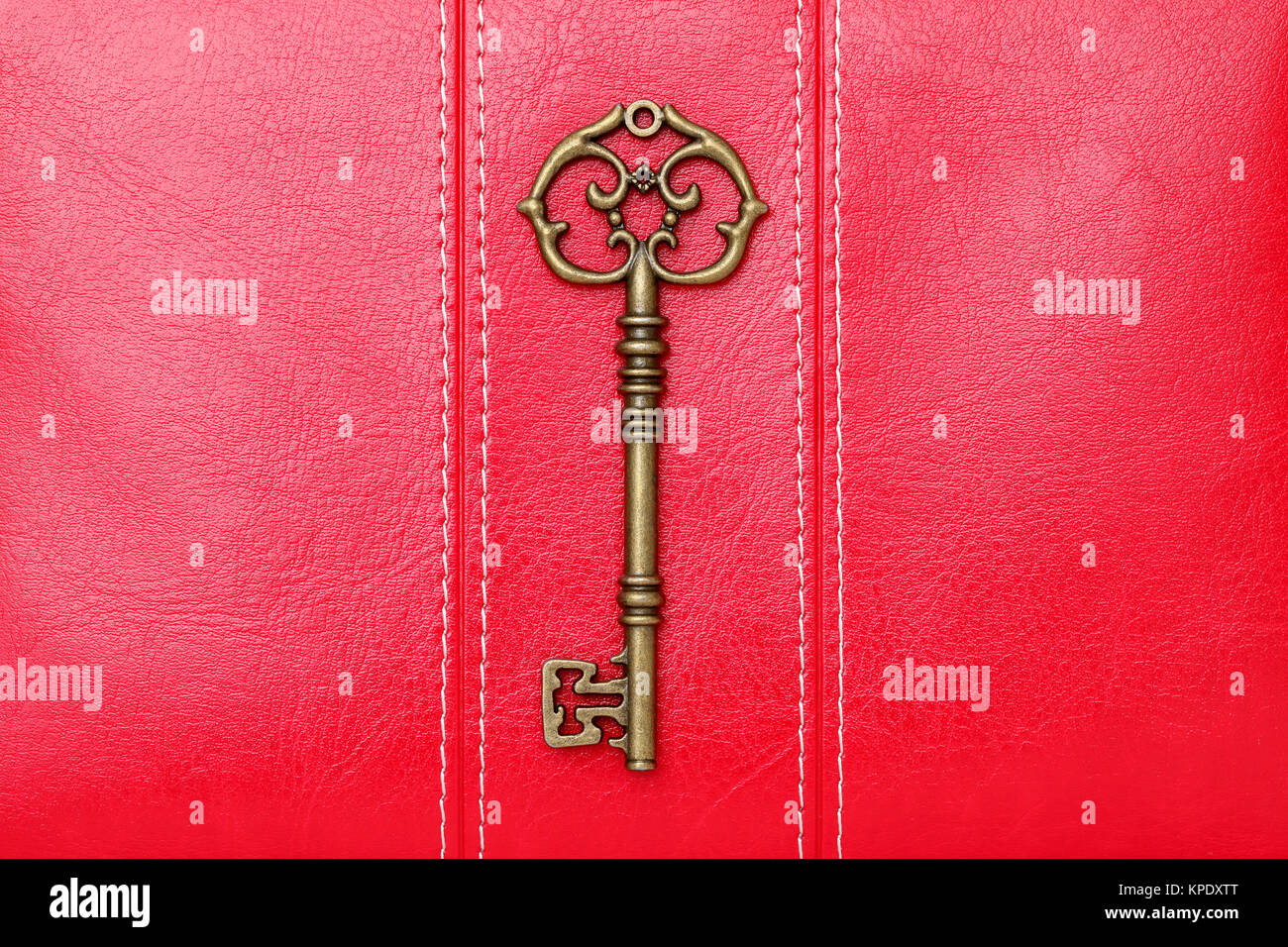 antique door key on a leather background Stock Photo Alamy