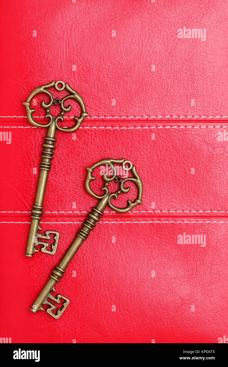 Vintage door key on a leather background Stock Photo Alamy