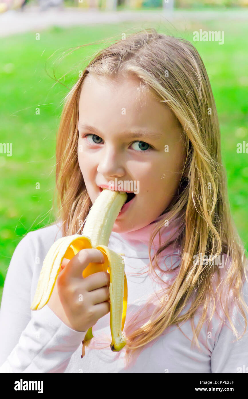 Girl are eating banana Stock Photo Alamy