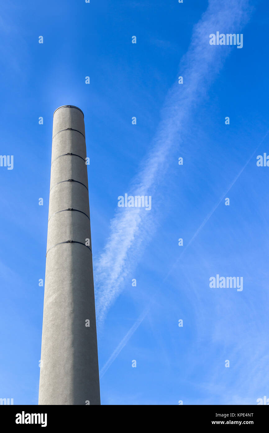 Chimney against blue sky Stock Photo - Alamy