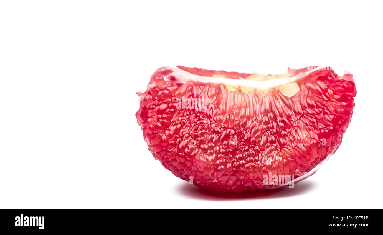Red pomelo pulp with seeds isolated on white background with clipping