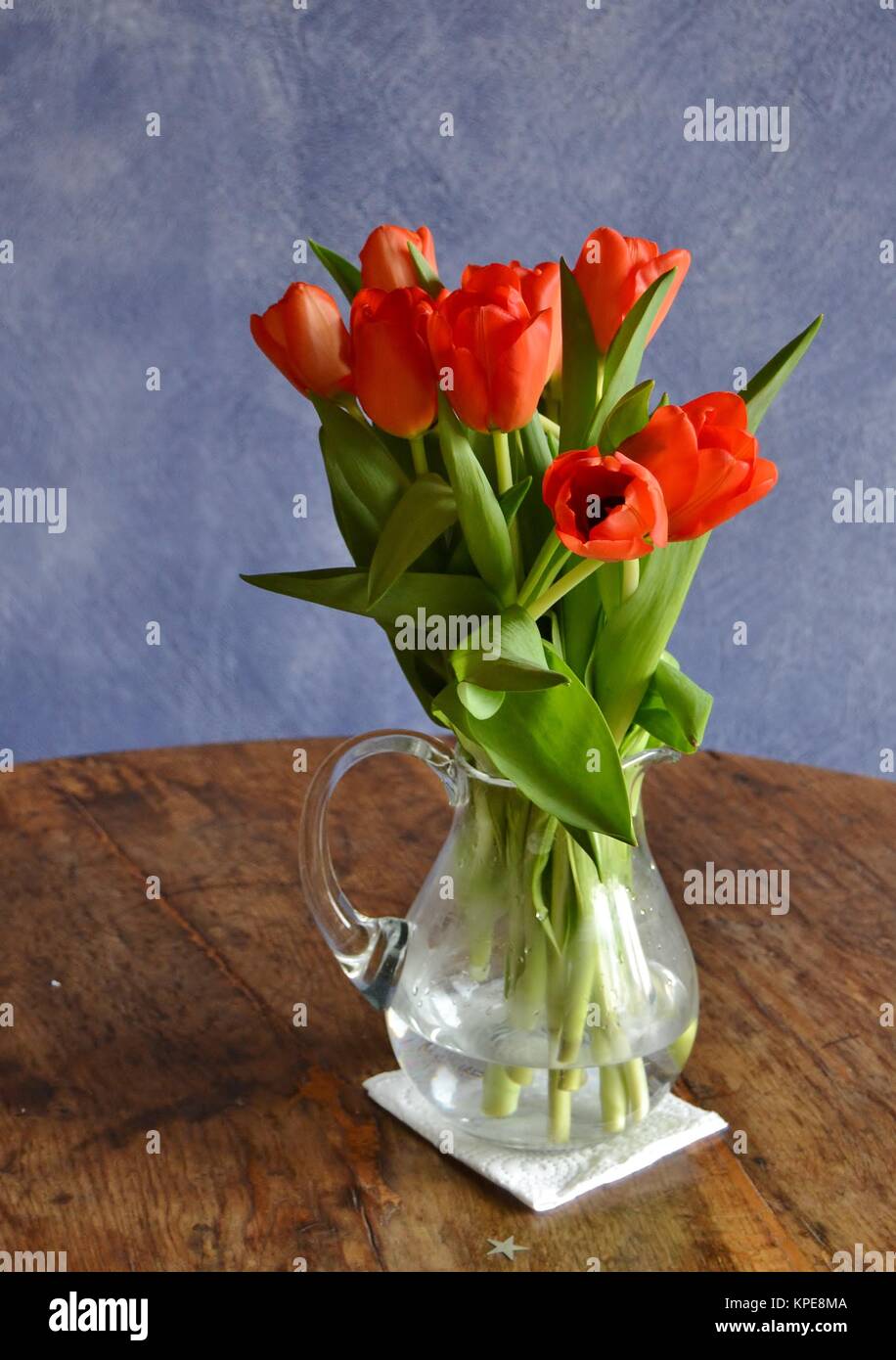 tulips in glass jug Stock Photo - Alamy