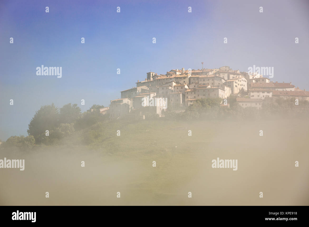 Castelluccio in morning fog piano grande umbria italy stock photo