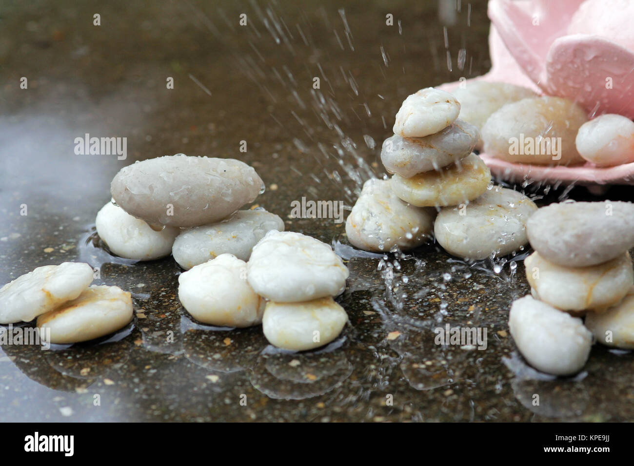 raindrops on cold stones Stock Photo