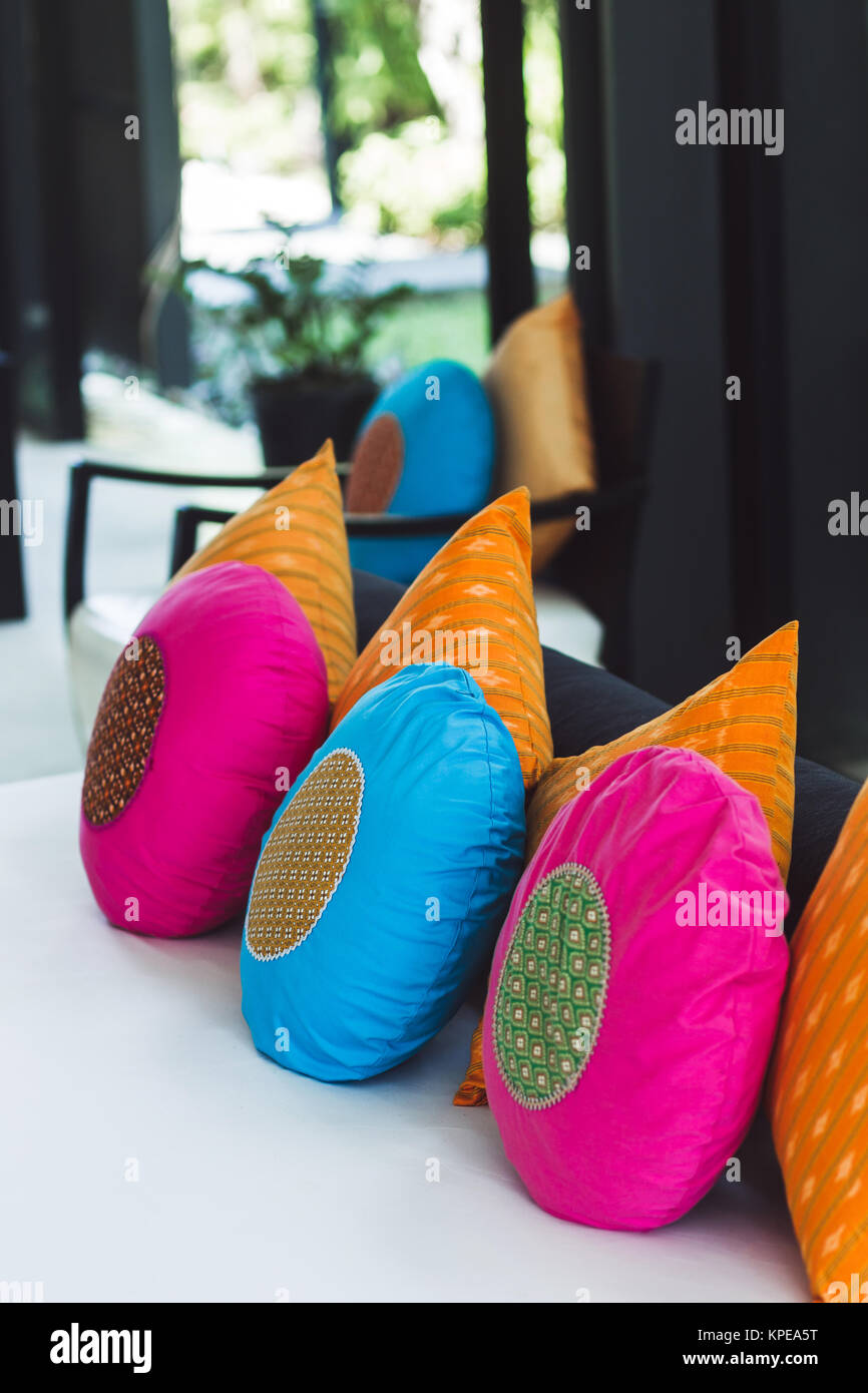 Multicolor round pillows on sofa Stock Photo Alamy