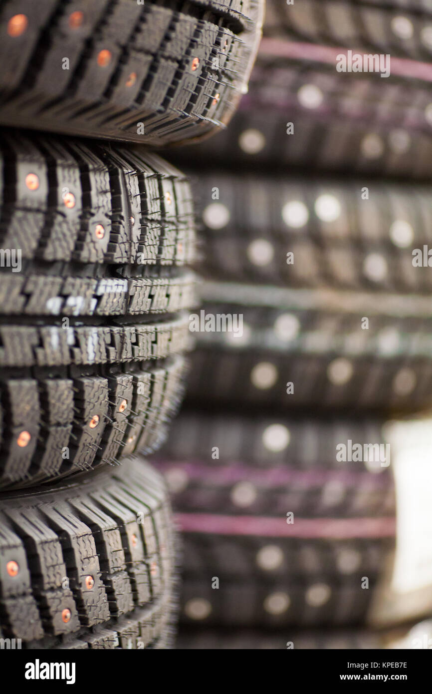 Studded tire on a background winter studded tires for a car new close