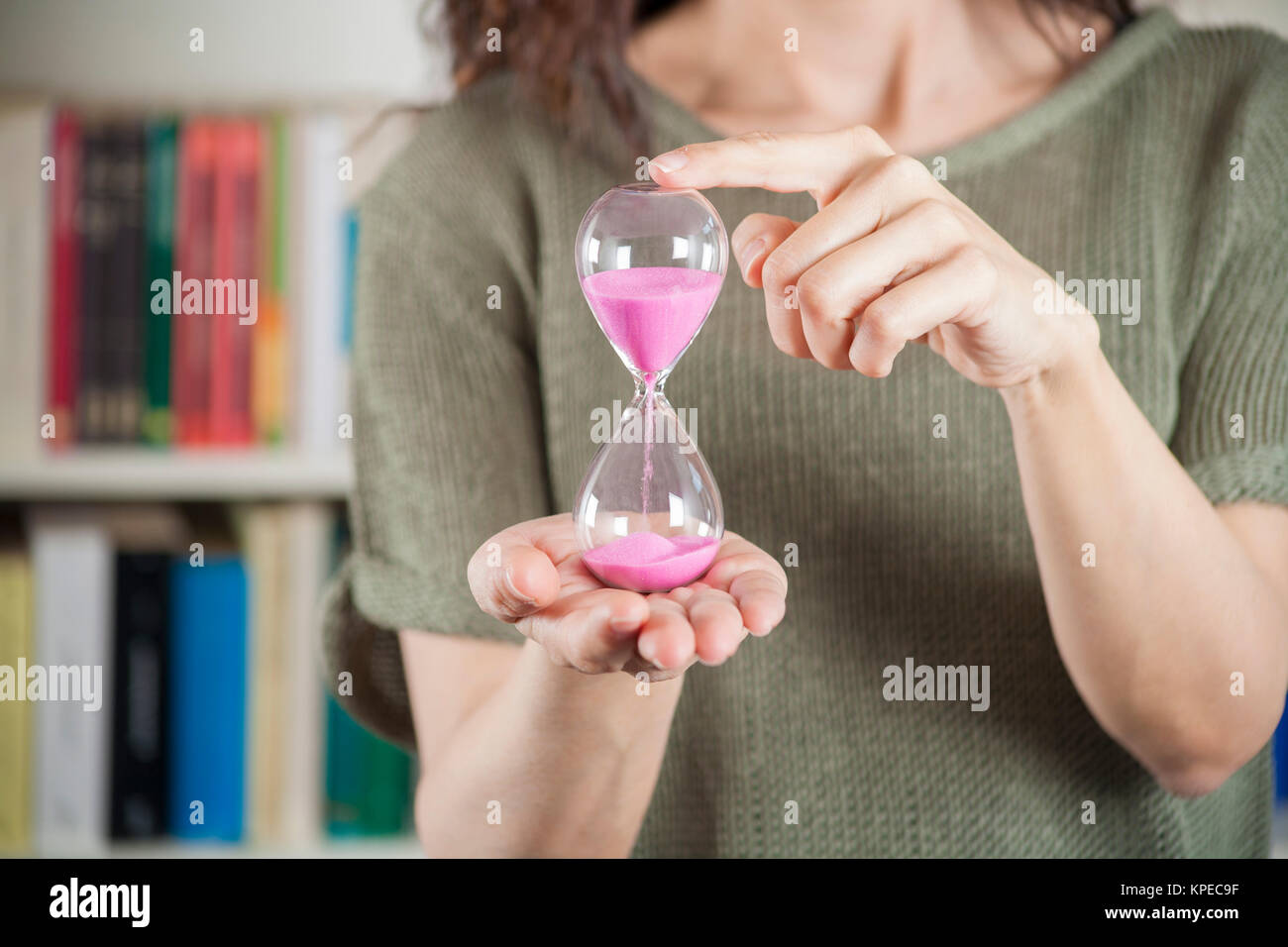 woman with pink sand clock Stock Photo