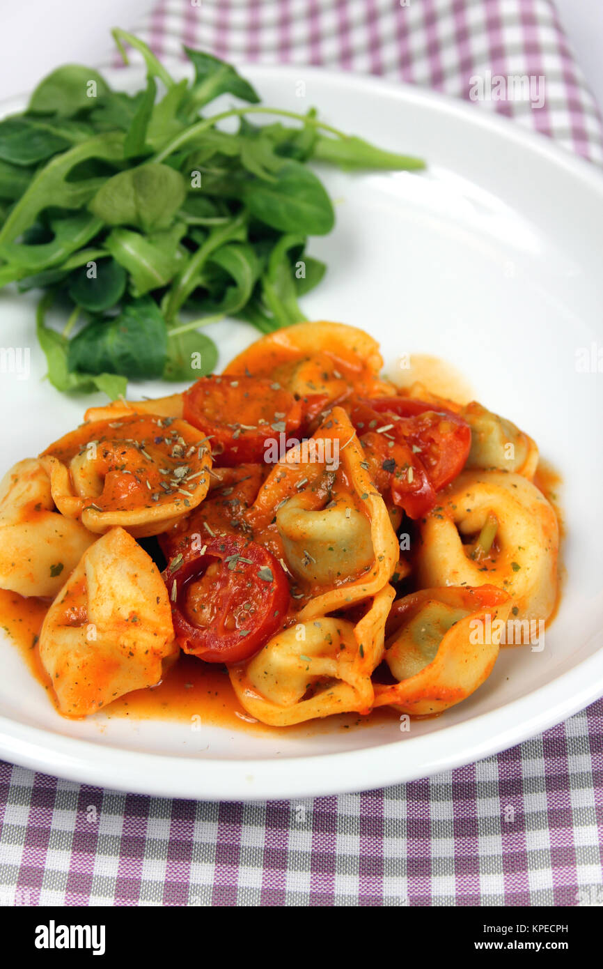 Tortellini in tomato cream sauce Stock Photo Alamy