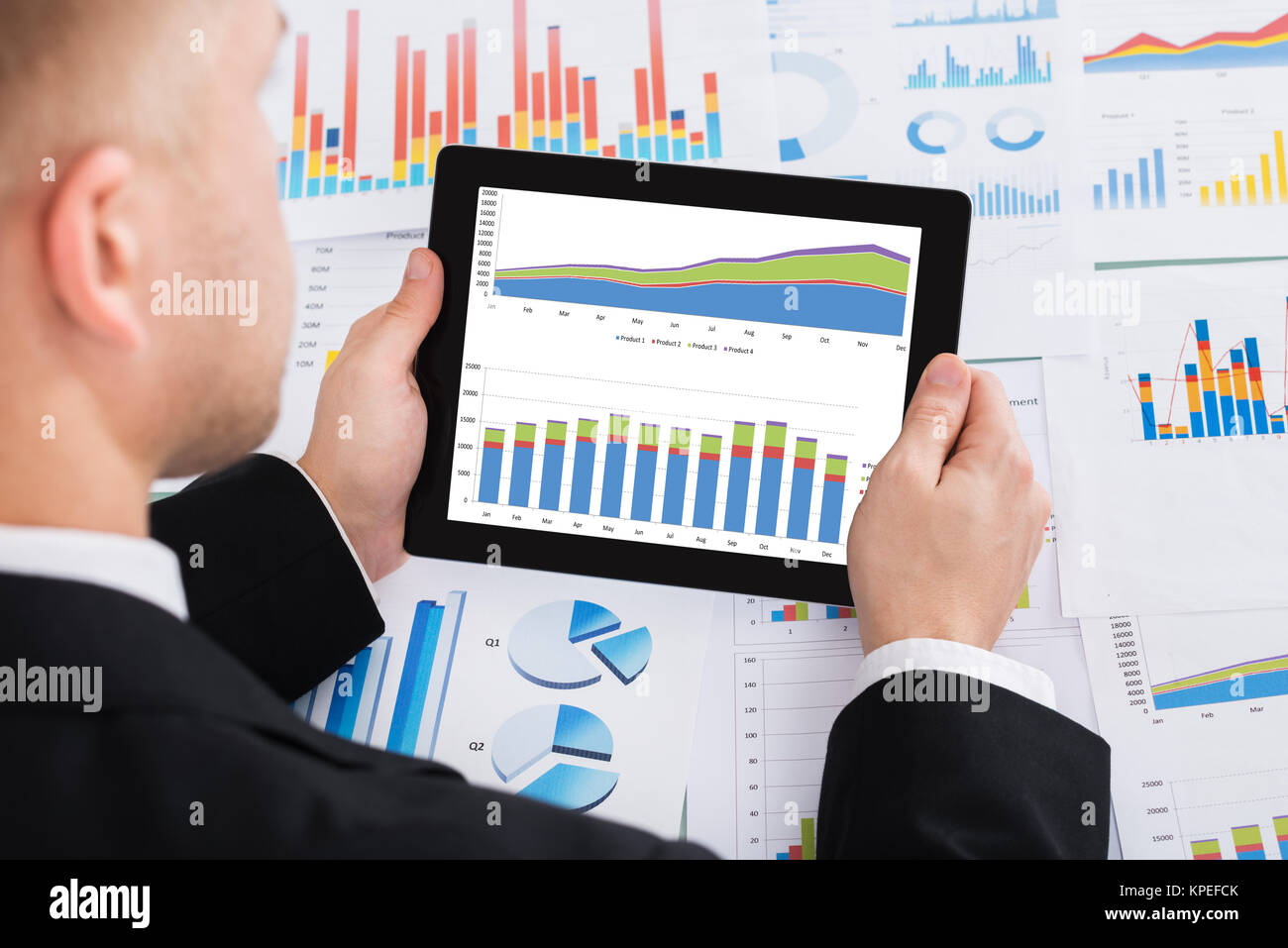 Businessperson Analyzing Graph On Digital Tablet Stock Photo - Alamy