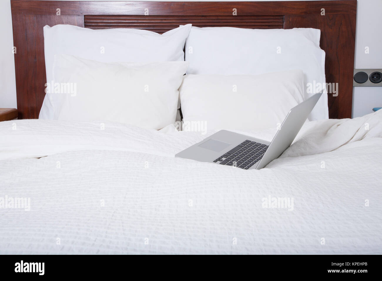 laptop on bed Stock Photo Alamy