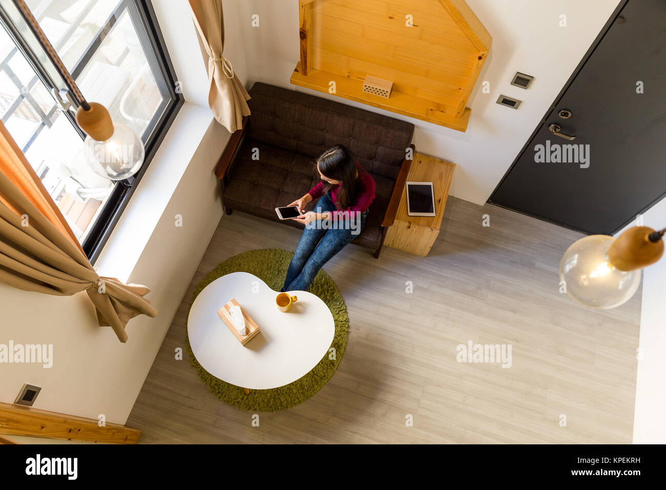 Using Phone Top View Top view of woman use of mobile phone at home Stock Photo - Alamy