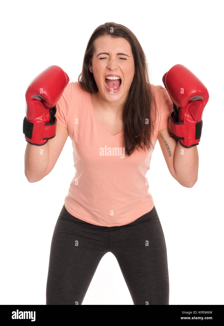 young woman with boxing gloves screams Stock Photo