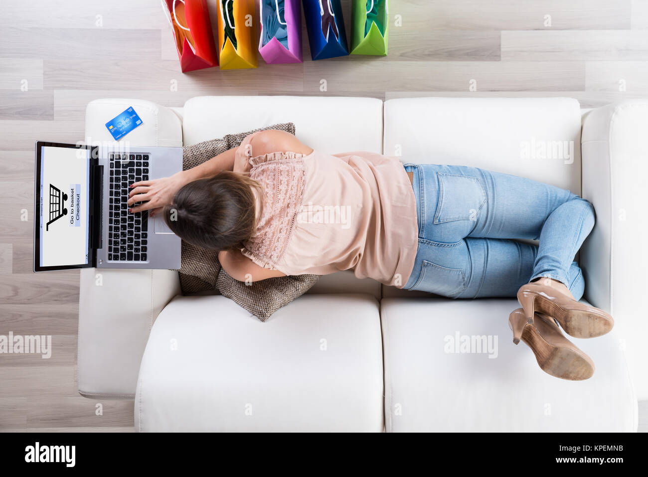Woman On Sofa Shopping Online With Laptop Stock Photo Alamy