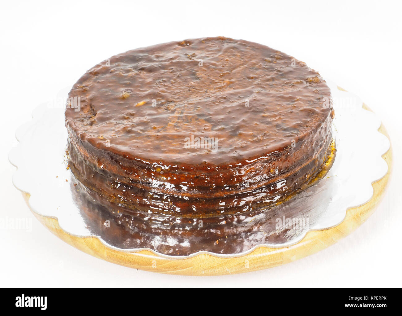 Apricot glazed Sacher torte chocolate cake on silver mirror plate Stock Photo