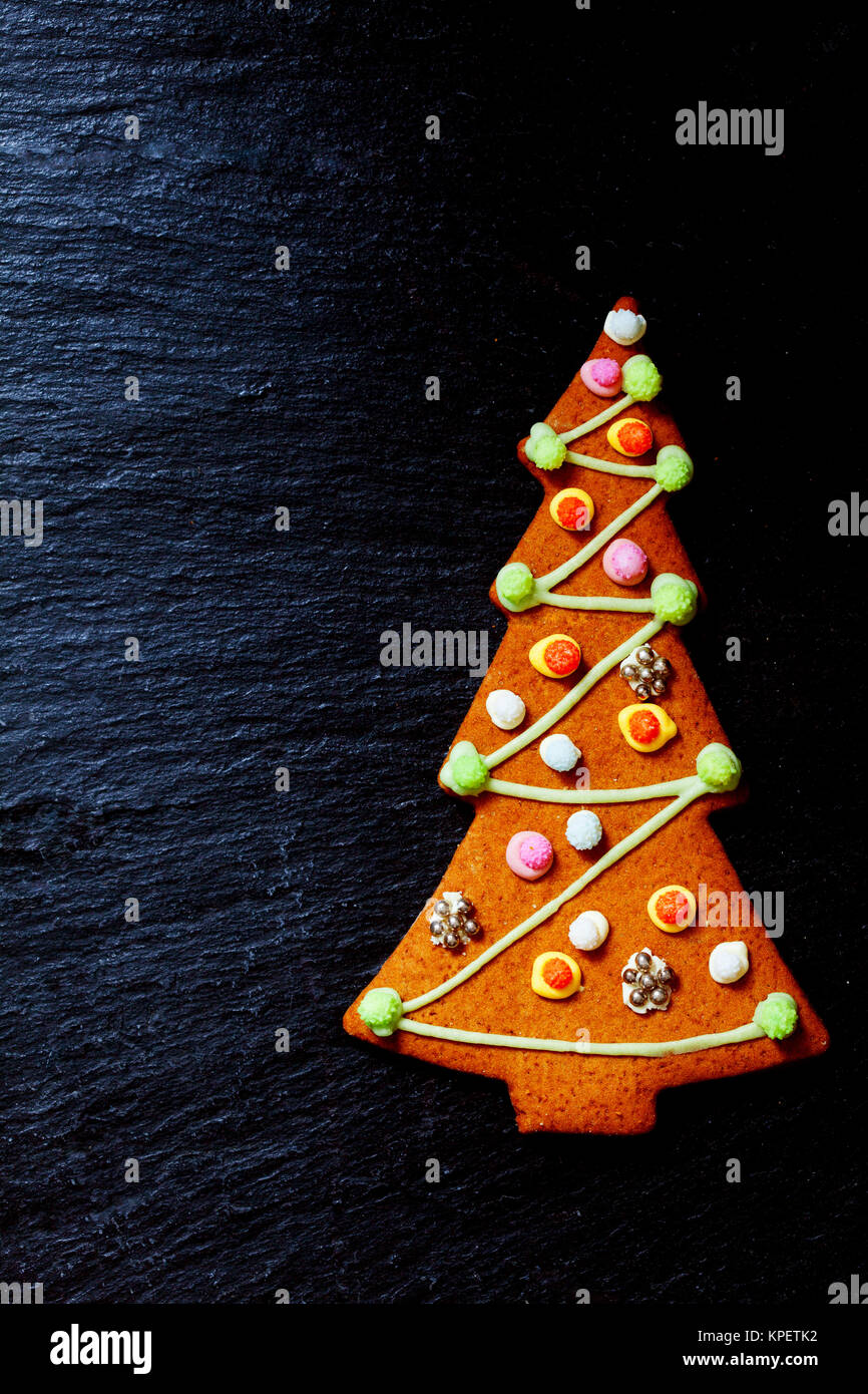 Gingerbread Christmas tree on black with space for texts Stock Photo
