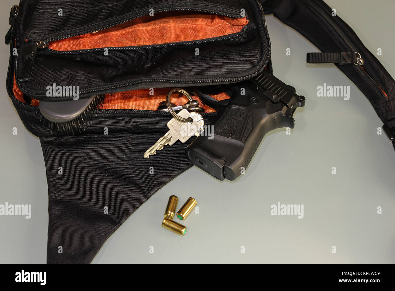 Carried concealed. Handgun and accessories falling from a woman's purse