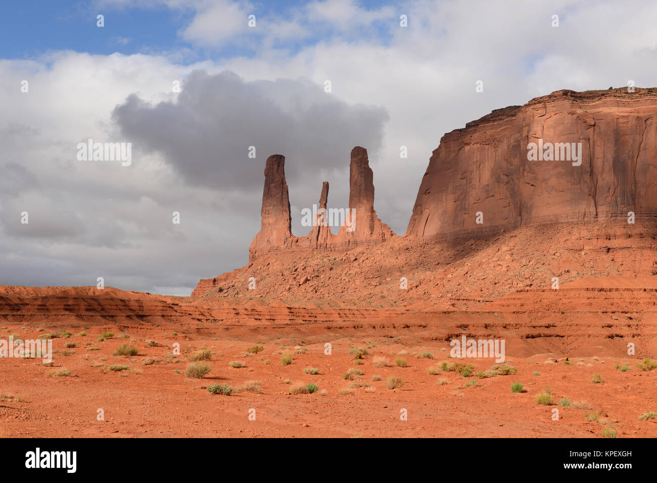 Sandstone Formation of Three Sisters - The close view of unique sandstone spires, called 'Three Sisters', in the Monument Valley, Utah & Arizona, USA. Stock Photo