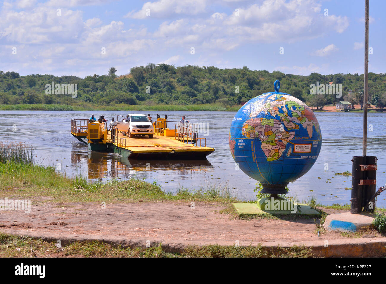 Uganda is called 'The pearl of Africa' because of its beautiful landscapes, friendly people, and abundance of rain. Globe of world on Nile river. Stock Photo