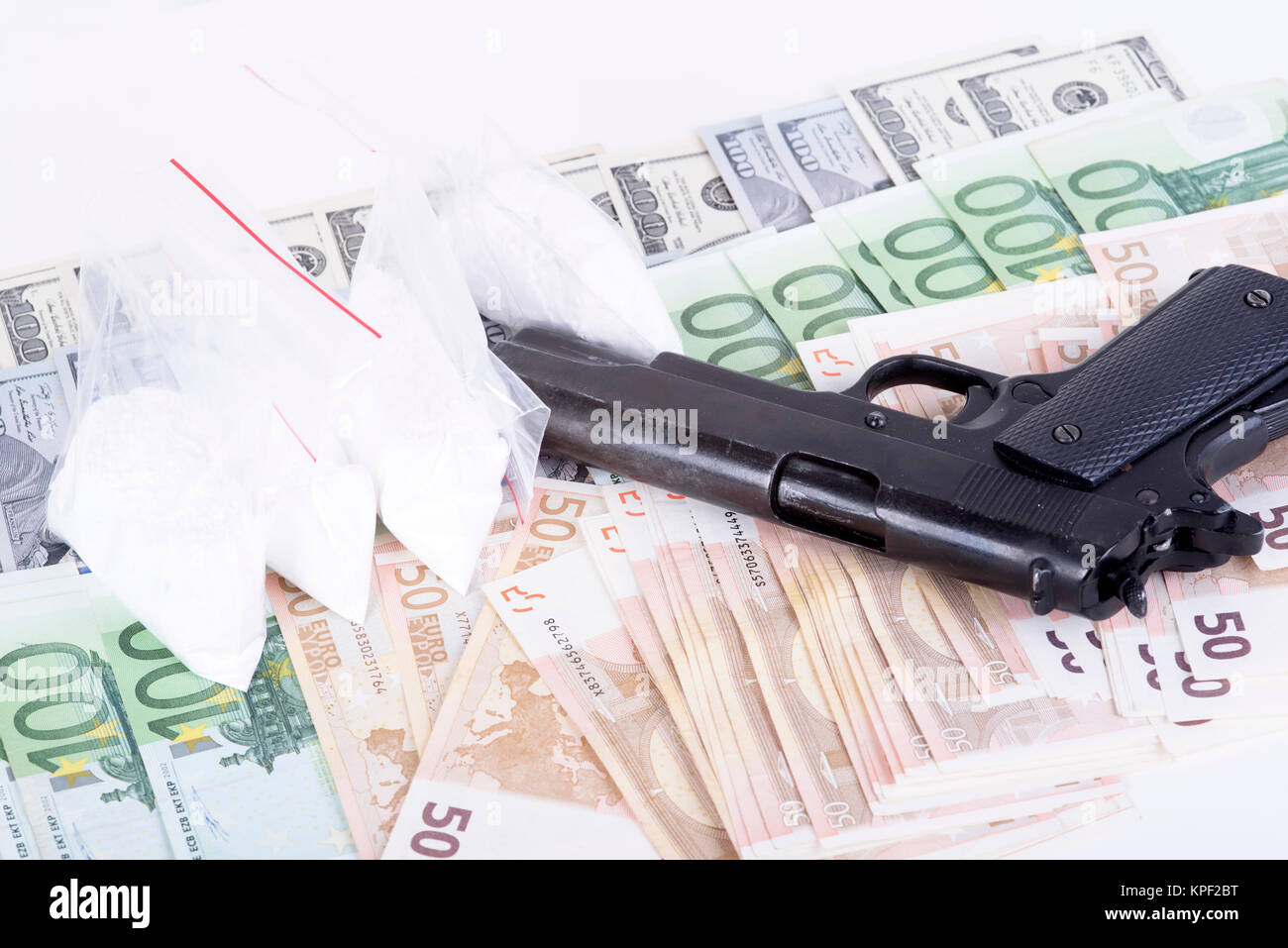 photo of the drugs, cocaine , money and gun Stock Photo