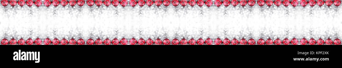 Christmas border or banner with ornaments arranged in a row on show, extra wide and isolated on white background Stock Photo