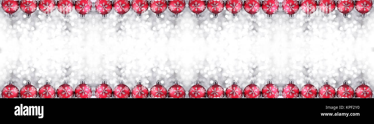Christmas border or banner with ornaments arranged in a row on show, extra wide and isolated on white background Stock Photo