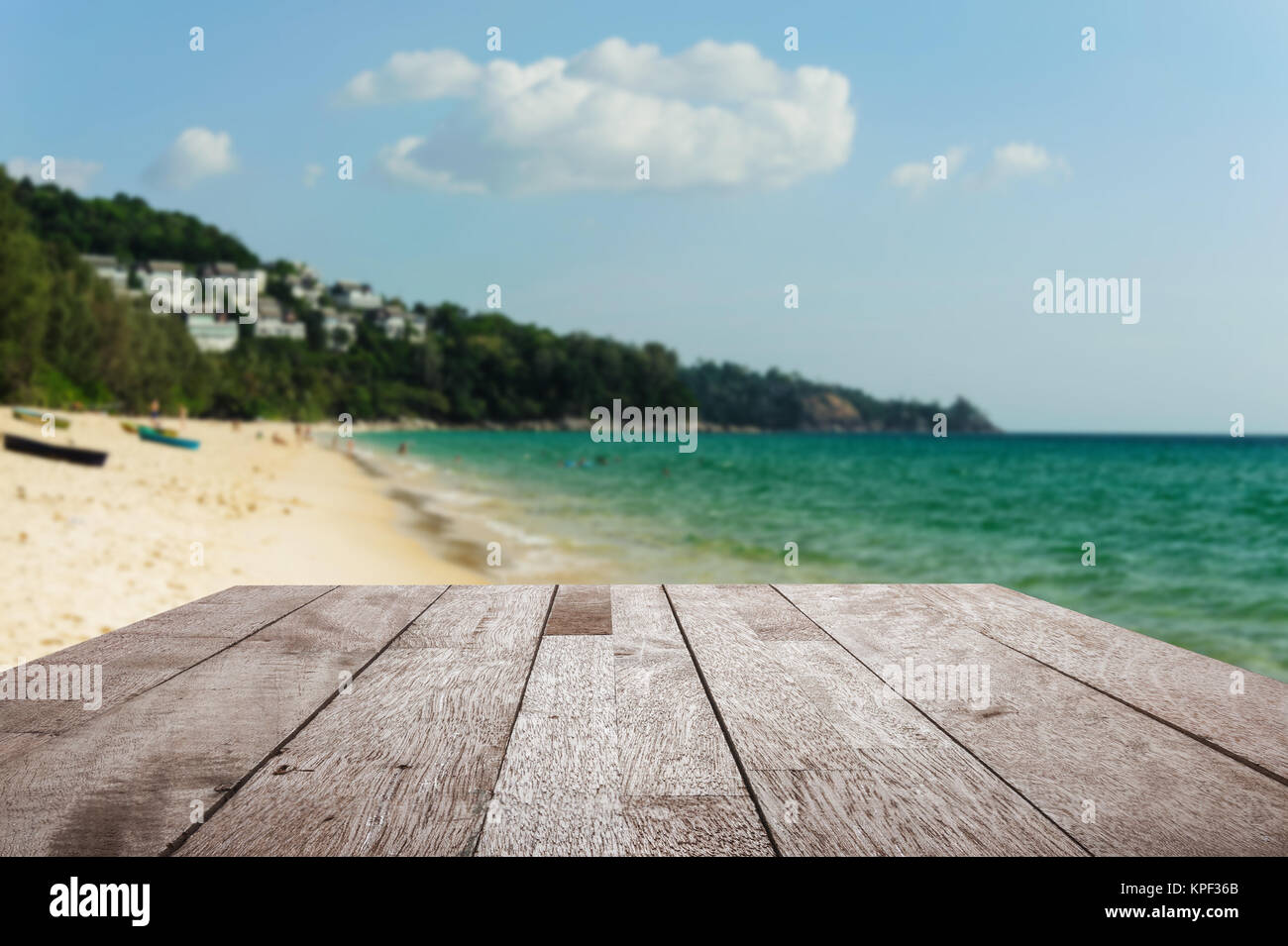 Wood Floor Top On Blurred Blue Sea And White Sand Beach With Some
