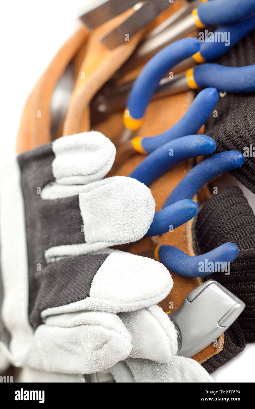 macro image of a tool belt and hand gloves Stock Photo Alamy