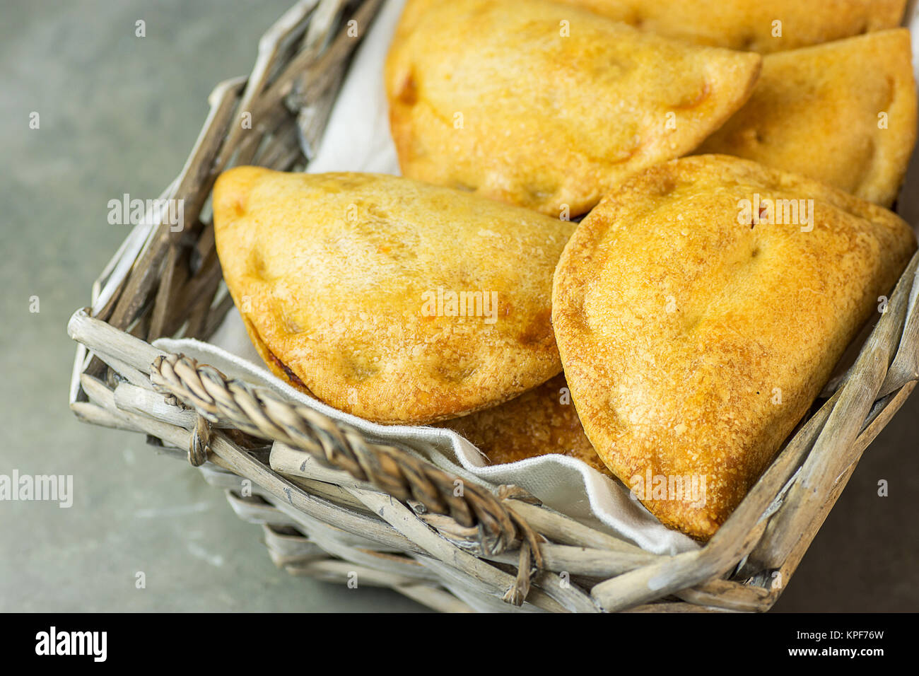 Home Baked Empanadas Turnover Pies with Pisto Vegetable Cheese Filling in Tomato Sauce in Wicker
