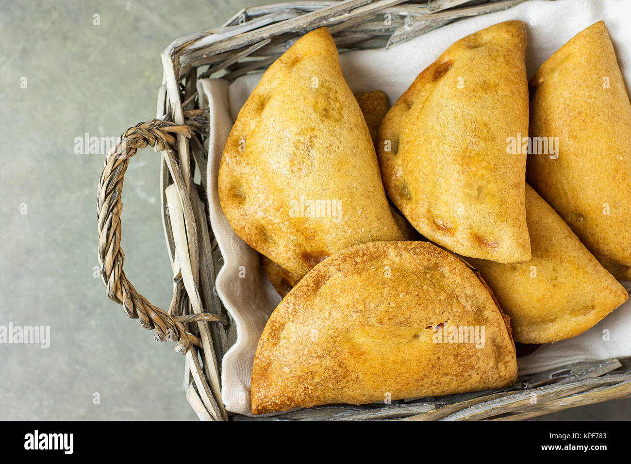 Home Baked Empanadas Turnover Pies with Pisto Vegetable Cheese Filling in Tomato Sauce in Wicker