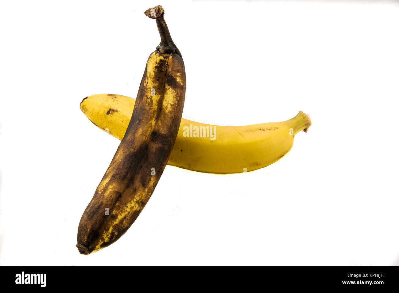 One yellow banana and one older brown banana with white background