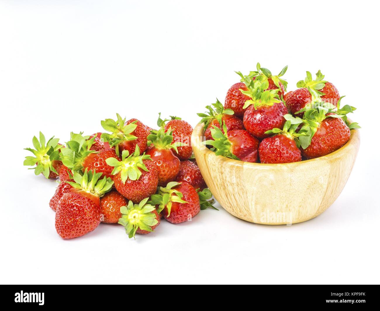 fresh whole strawberries in wooden bowl Stock Photo - Alamy