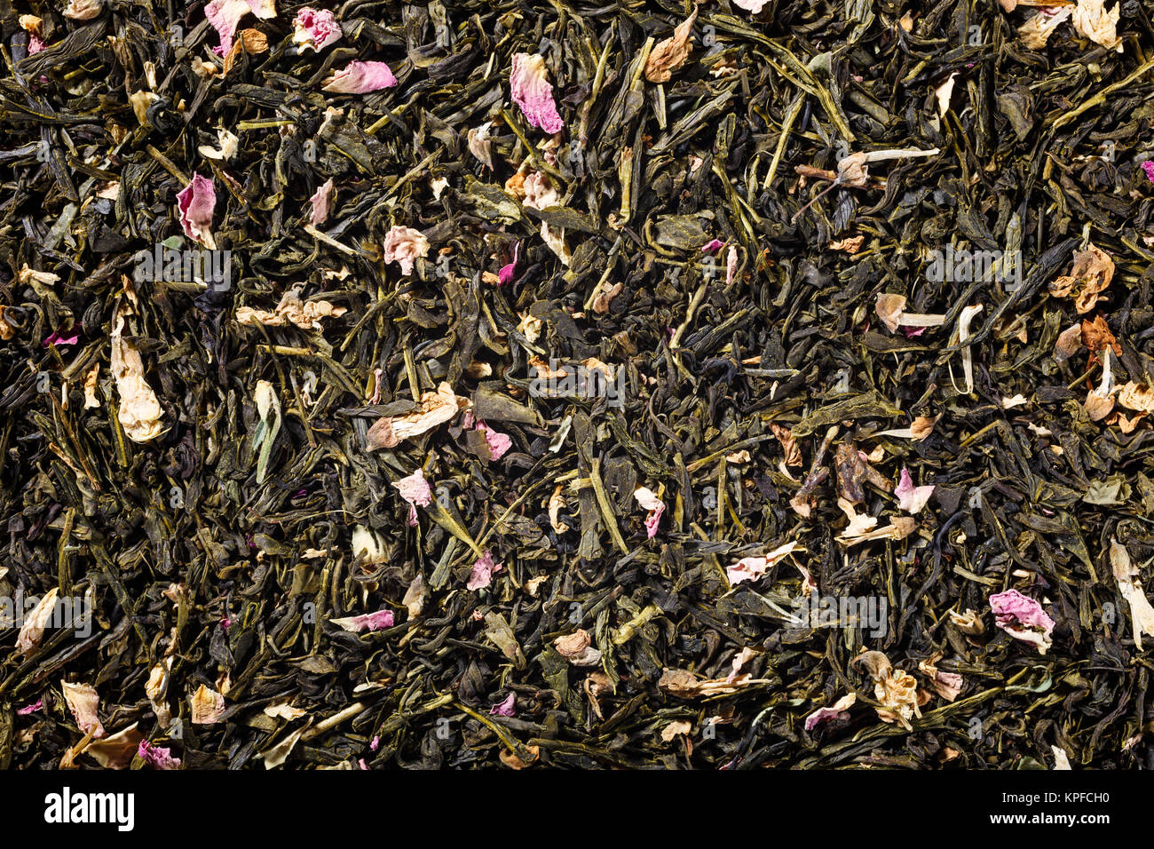Background with green tea, robinia and rose blossom with copy space. Top view. Stock Photo
