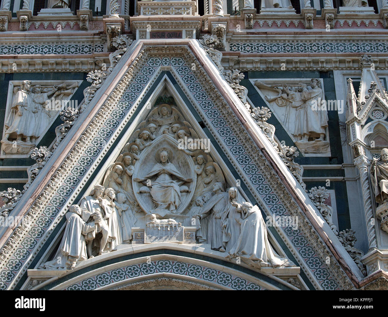 Florence - beautiful composition with  Virgin Mary above the portal on the facade of the Santa Maria del Fiore cathedral Stock Photo