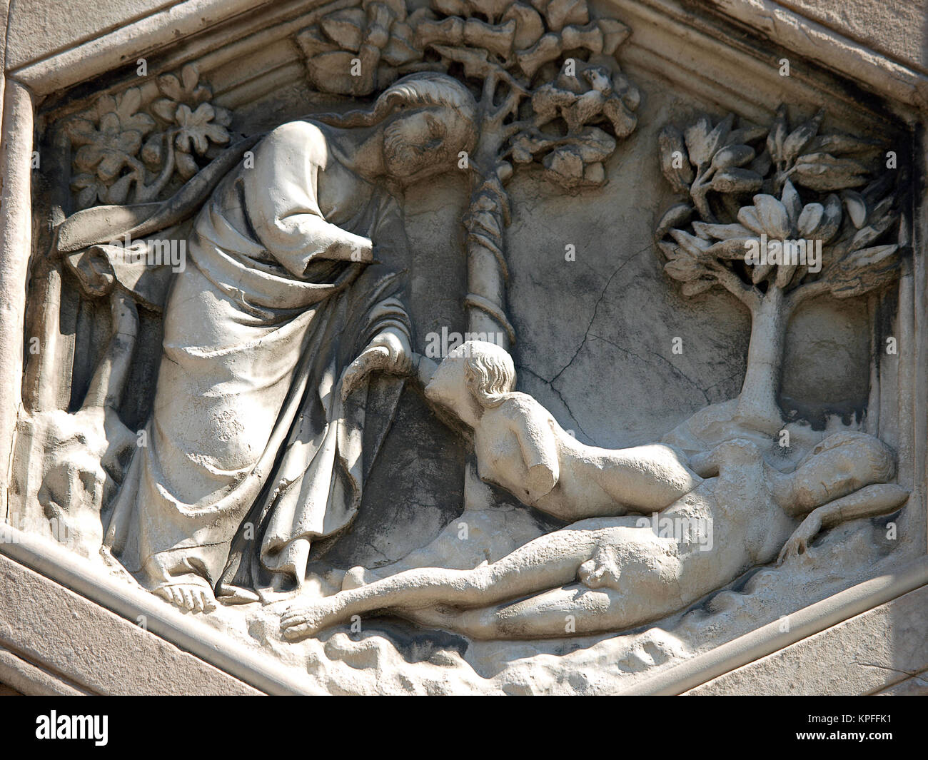 Florence - The hexagonal Relief on the Giottos' Campanile.The hexagonal panels on the lower level depict the history of mankind, inspired by Genesis. Stock Photo