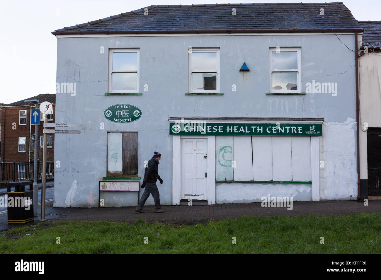 Chinese Health Centre, practising Chinese Medicine, closed and boarded up in Carmarthen Stock Photo