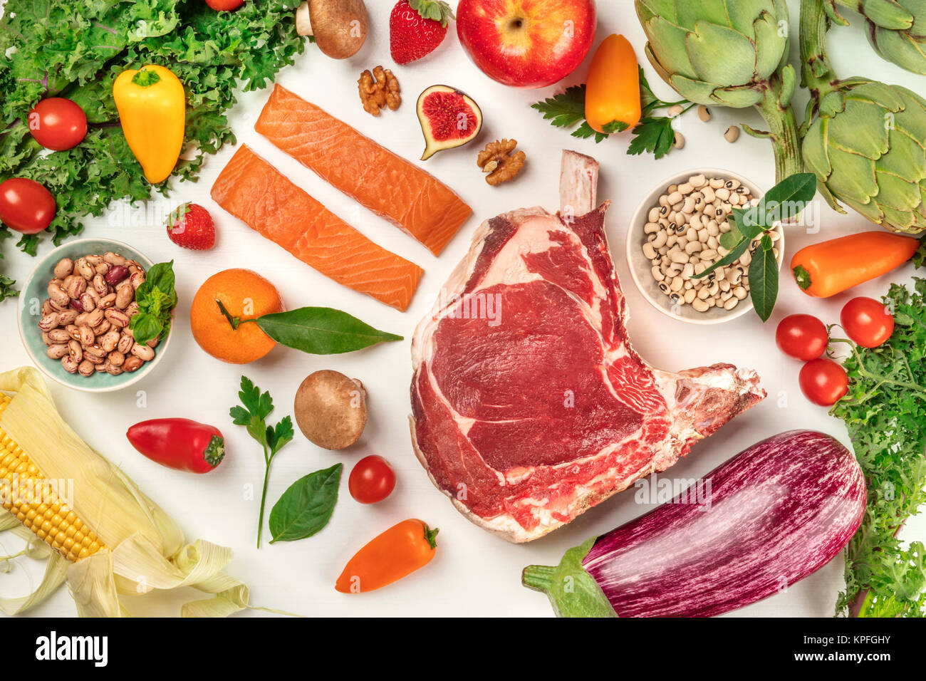 Overhead photo of fresh food. Vegetables, fruits, legumes, fish, and