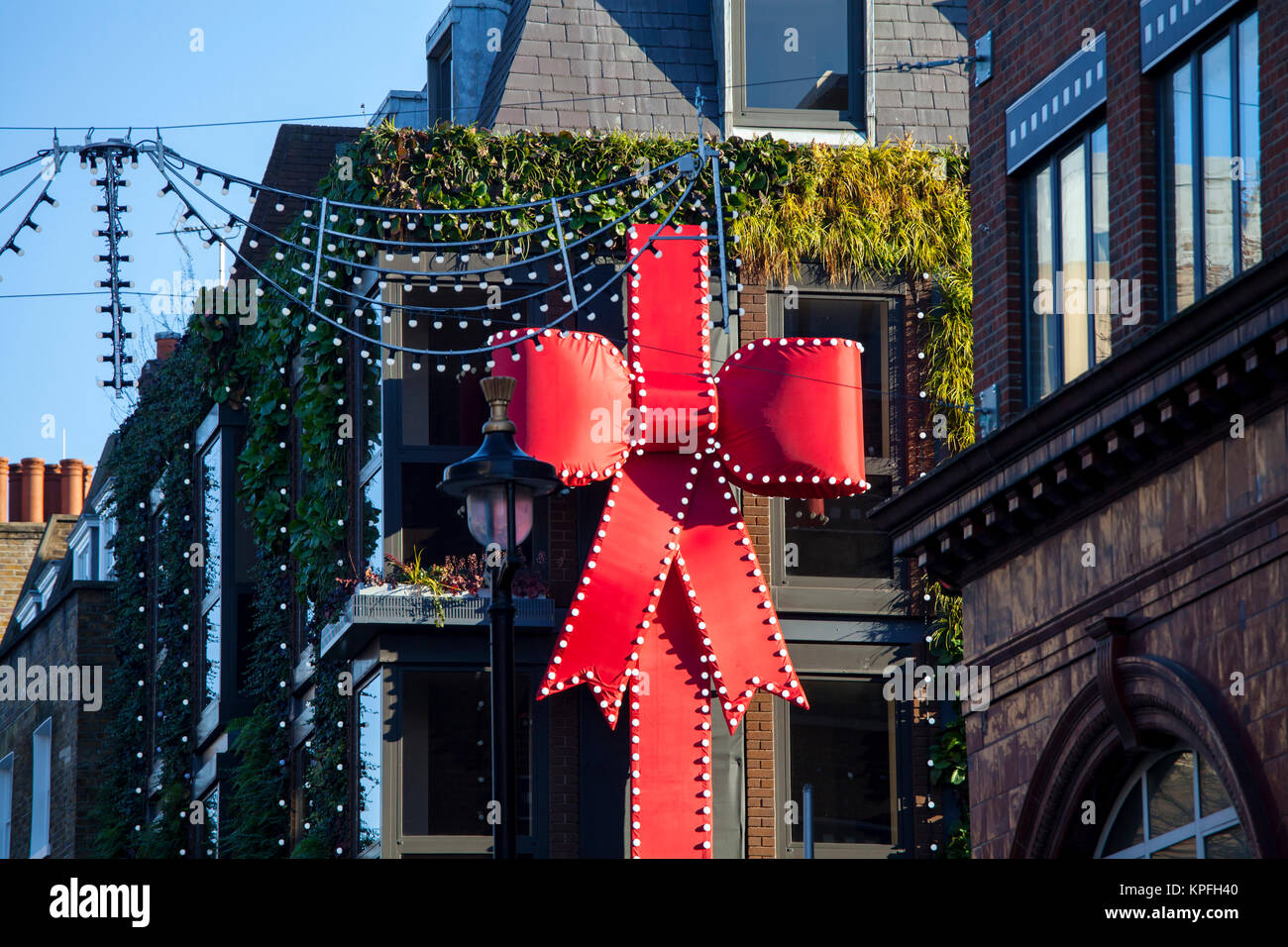 LONDON, UNITED KINGDOM - DECEMBER 12th, 2017: Christmas decoration are placed on the building around Covent Garden. Stock Photo