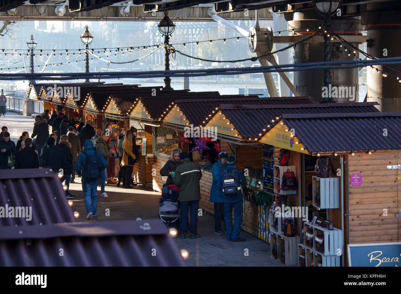 LONDON, UNITED KINGDOM - DECEMBER 12th, 2017: People enjoy Christmas Market set along the river Thames on Southbank in London, UK. Stock Photo